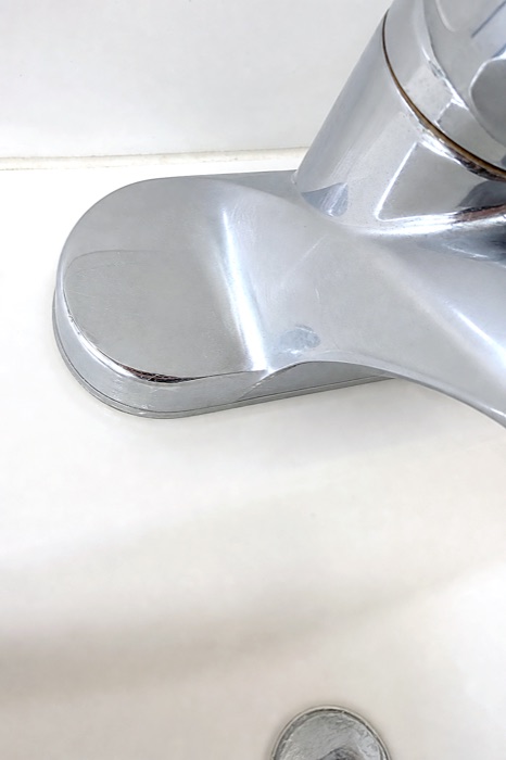 Polished chrome bathroom faucet after a NeatNow cleaning