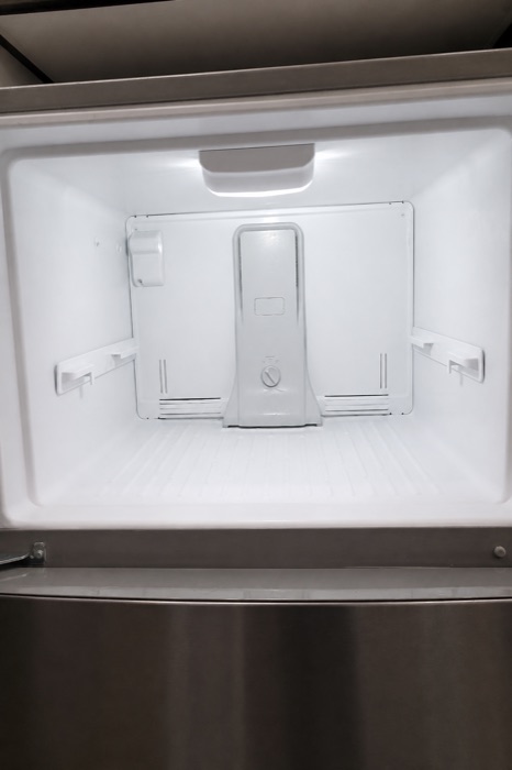 Clean, empty freezer interior after a NeatNow cleaning