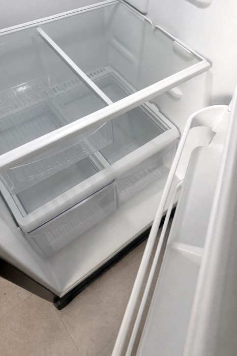 Spotless refrigerator interior with clean drawers after a NeatNow cleaning