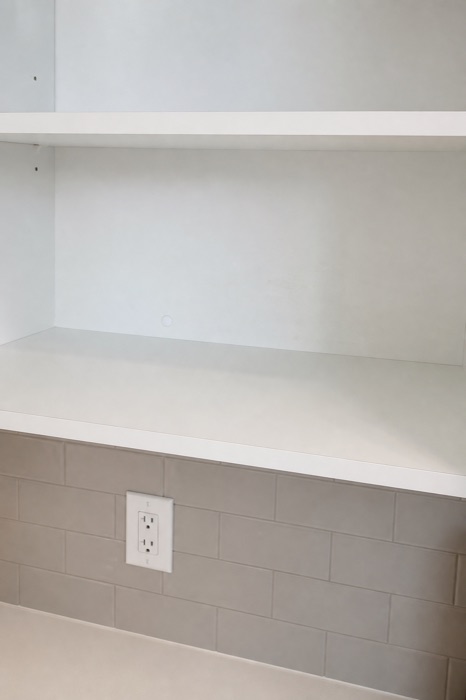 Clean, clear white shelf after a NeatNow cleaning